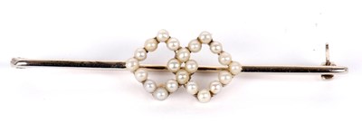 Lot 80 - An 18ct seed pearl bar brooch, set to centre...