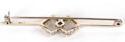 Lot 80 - An 18ct seed pearl bar brooch, set to centre...