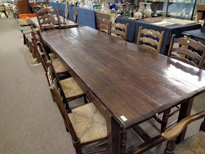 Lot 480 - A large oak refectory dining table with H...