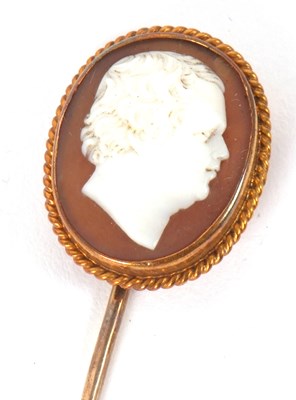 Lot 64 - A cameo stick pin, the oval shell cameo,...