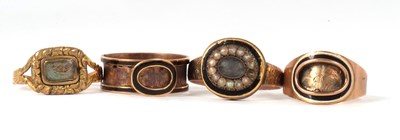 Lot 85 - Four 19th century memorial rings, all unmarked,...