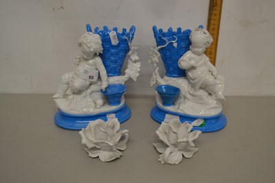 Lot 55 - A pair of continental porcelain models of...