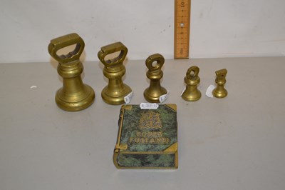 Lot 58 - A group of five small brass weights together...