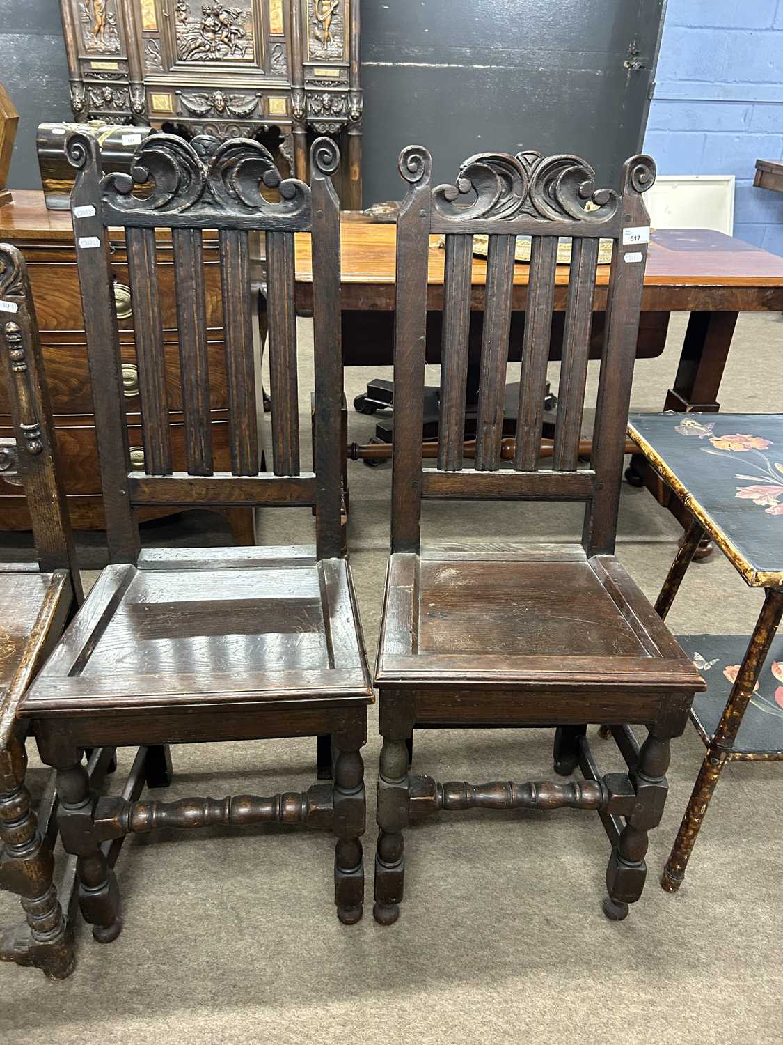 Lot 517 - A pair of 18th Century hard seated hall chairs...