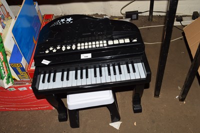 Lot 590 - CHILD'S MINIATURE ELECTRIC PIANO