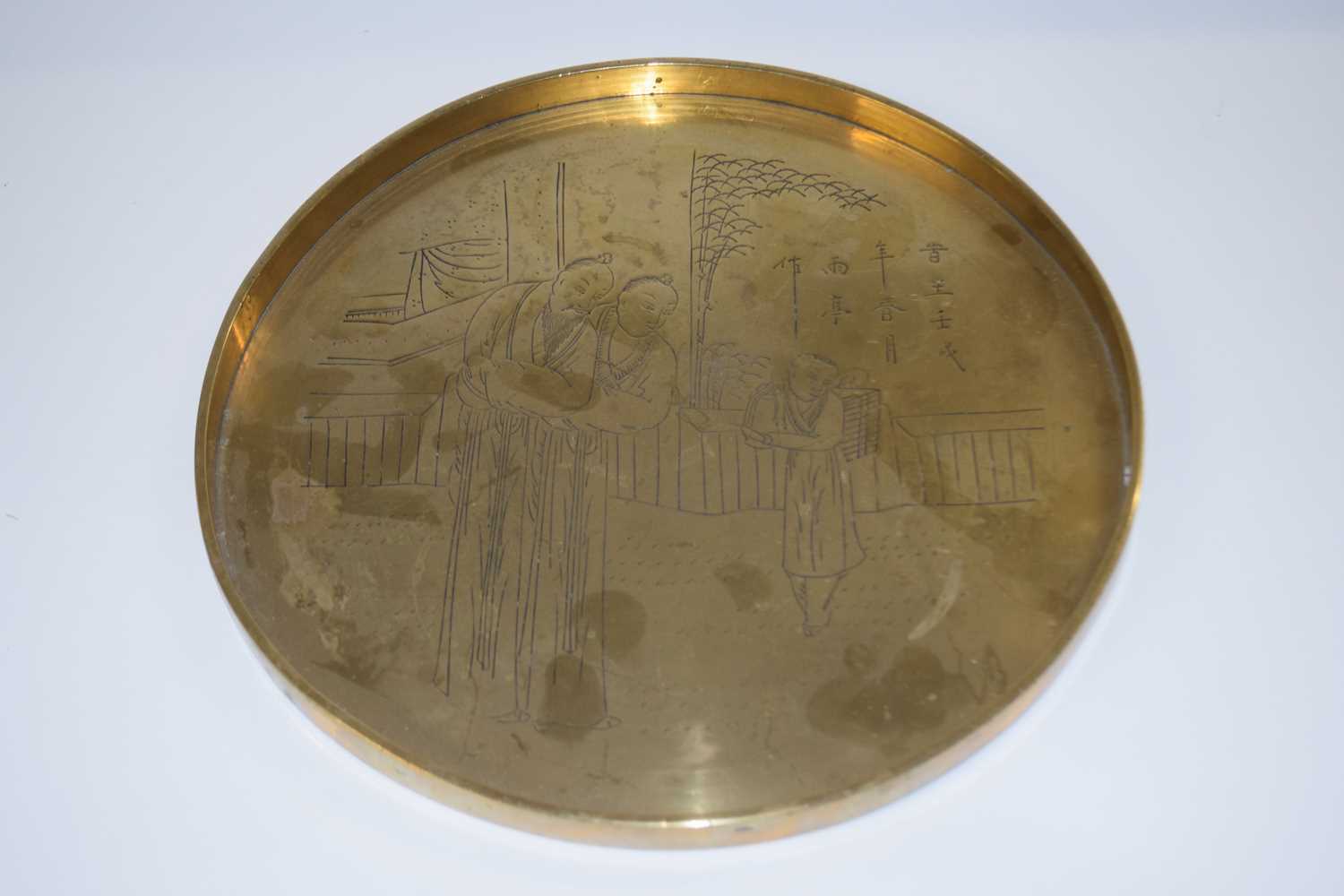 Lot 274 - A Chinese brass tray decorated with Chinese...