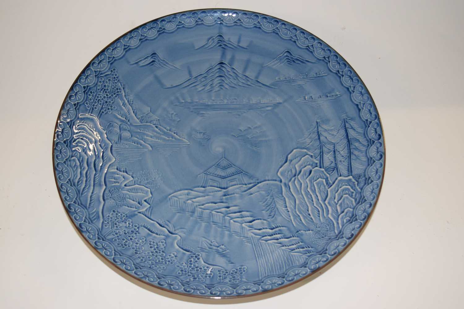 Lot 280 - A Japanese porcelain dish with a blue and...