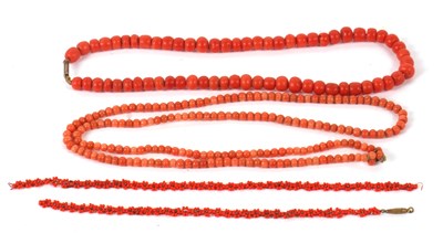Lot 112 - Two coral bead necklaces, the first with beads...