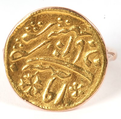 Lot 24 - A Middle Eastern coin ring, the coin with a...