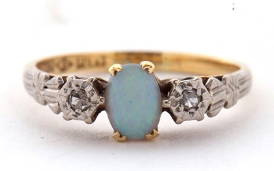 Lot 1 - An 18ct and platinum opal and diamond ring,...