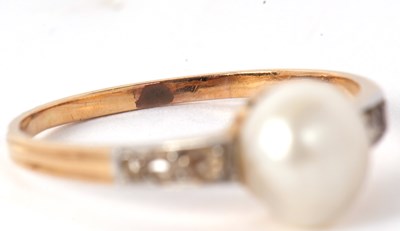 Lot 9 - A 'pearl' and diamond ring, the central 'pearl'...