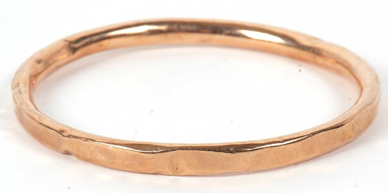 Lot 36 - A 9ct gold bangle, the round hollow bangle...