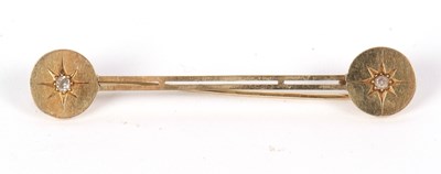 Lot 45 - A diamond bar brooch, set with a round disc to...