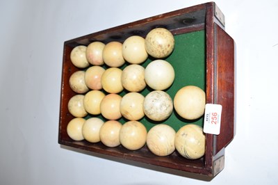 Lot 256 - Baize lined box containing 22 ivory billiard...
