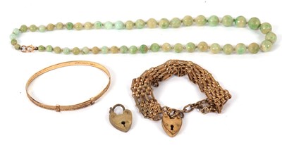Lot 140 - A green hardstone bead necklace with clasp...