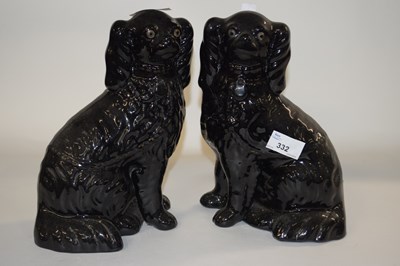 Lot 332 - Pair of black coloured Staffordshire dogs,...