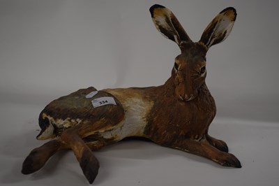 Lot 334 - A ceramic sculpture of a rabbit in...