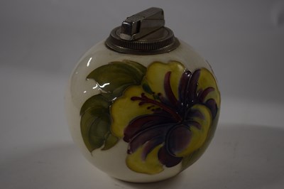 Lot 365 - A Moorcroft Pottery table lighter, the white...