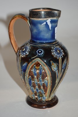 Lot 371 - A Lambeth Doulton jug with incised floral...
