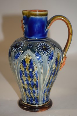 Lot 372 - A Doulton Lambeth jug with mask to the spout...