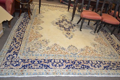 Lot 668 - A modern Kirman beige wool floor rug with...