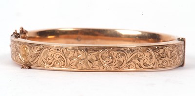 Lot 39 - A 9ct hinged bangle, the 9mm wide bangle with...