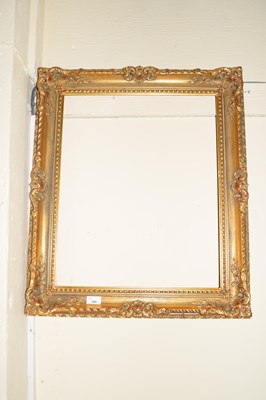 Lot 705 - FOLIATE MOULDED GILT PICTURE FRAME