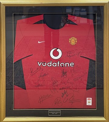 Lot 175 - A framed and glazed Manchester United shirt,...