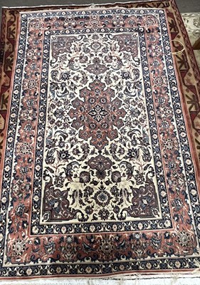 Lot 509 - A 20th Century Isfahan silk rug in pink blue...