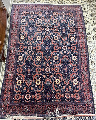 Lot 676 - A Persian Senneh wool floor rug with large...