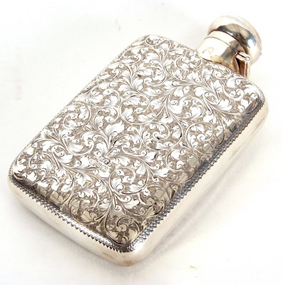 Lot 1 - A late Victorian spirit flask chased and...