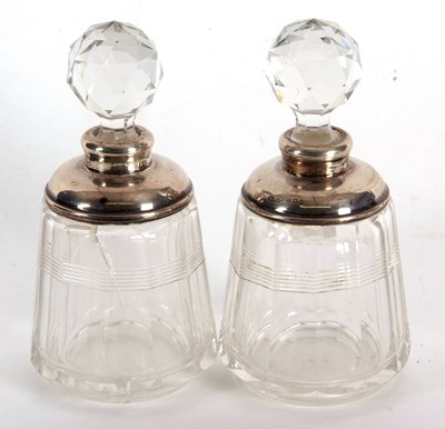 Lot 14 - A pair of glass scent bottles and stoppes with...