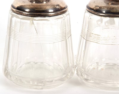 Lot 14 - A pair of glass scent bottles and stoppes with...