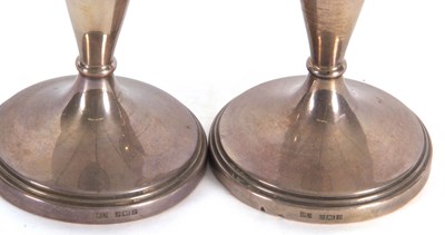 Lot 22 - A pair of Elizabeth II silver candle sticks of...