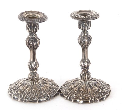 Lot 61 - A pair of late Victorian silver candlesticks,...