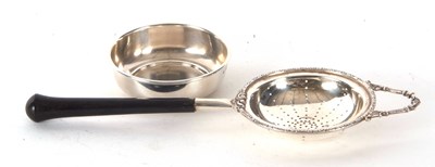 Lot 67 - A hallmarked silver tea strainer and drip bowl...