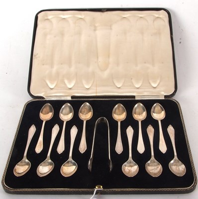 Lot 82 - A cased set of twelve silver teaspoons,...
