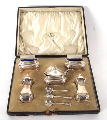 Lot 85 - A cased George V silver condiment set...