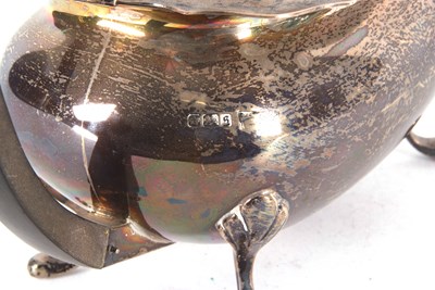 Lot 91 - A George V silver teapot of plain rectangular...