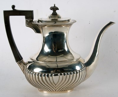 Lot 97 - A George V silver coffee pot, applied...