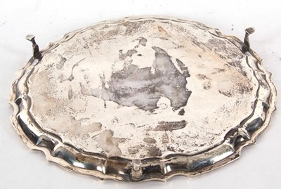 Lot 100 - A George V silver salver having a pie crust...