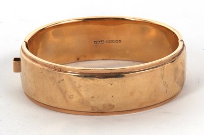 Lot 34 - A 9ct gold bangle, the upper half with...