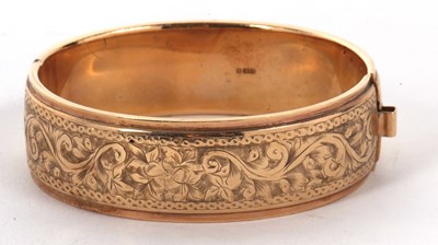 Lot 34 - A 9ct gold bangle, the upper half with...