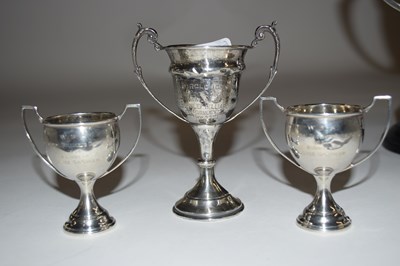 Lot 145 - Group of three small silver trophies presented...