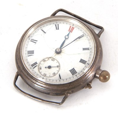 Lot 306 - A white enamel dialled trench watch, it has a...