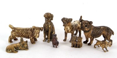 Lot 138 - A tin containing eight various dog ornaments,...