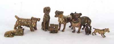 Lot 138 - A tin containing eight various dog ornaments,...