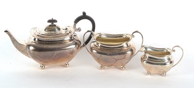 Lot 161 - A George V silver three piece tea service...