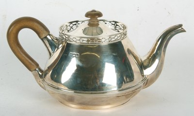 Lot 163 - A George V silver teapot of squat circular...