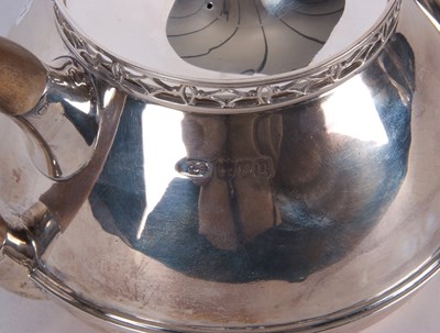 Lot 163 - A George V silver teapot of squat circular...
